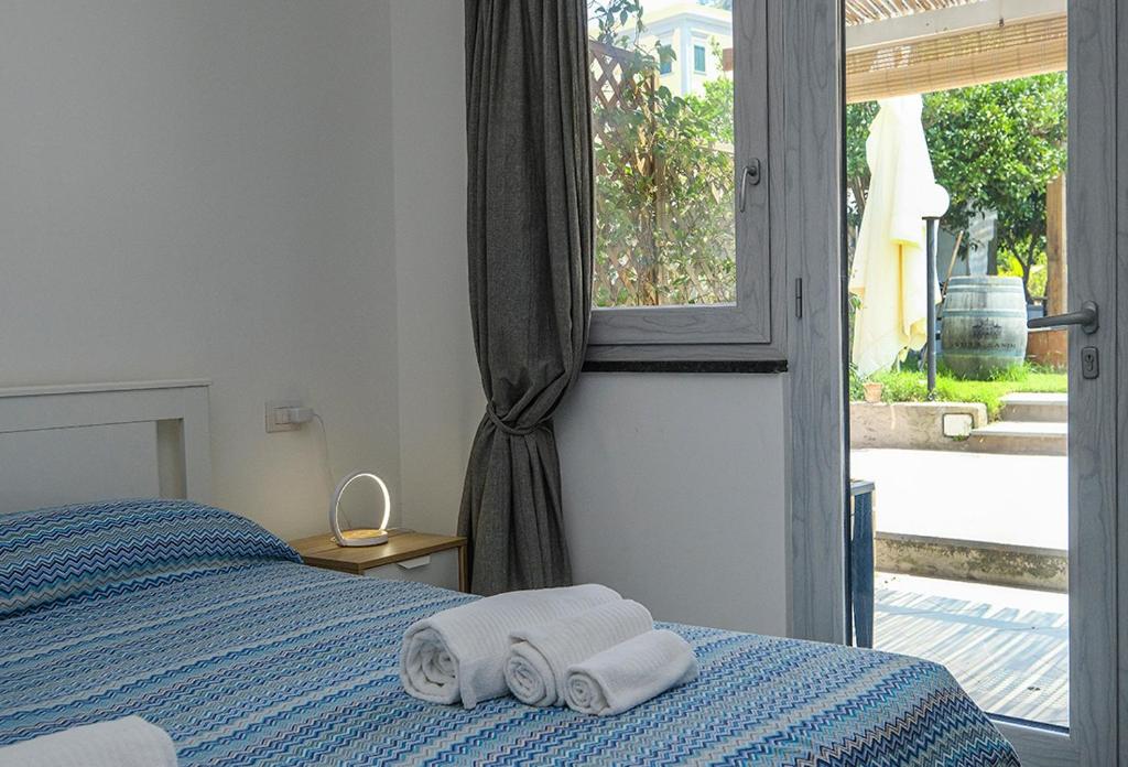 Łóżko lub łóżka w pokoju w obiekcie Numero20 B&B