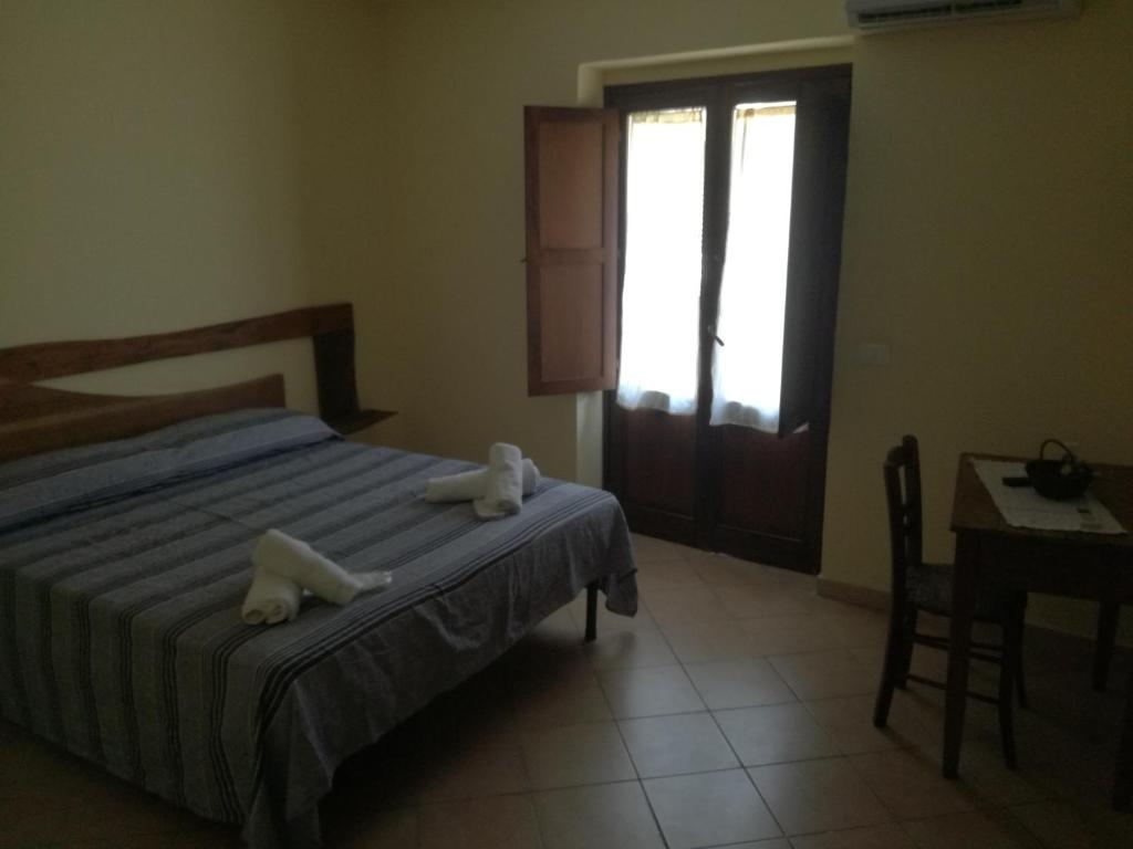 Postel nebo postele na pokoji v ubytování Albergo Diffuso IL MIGLIO