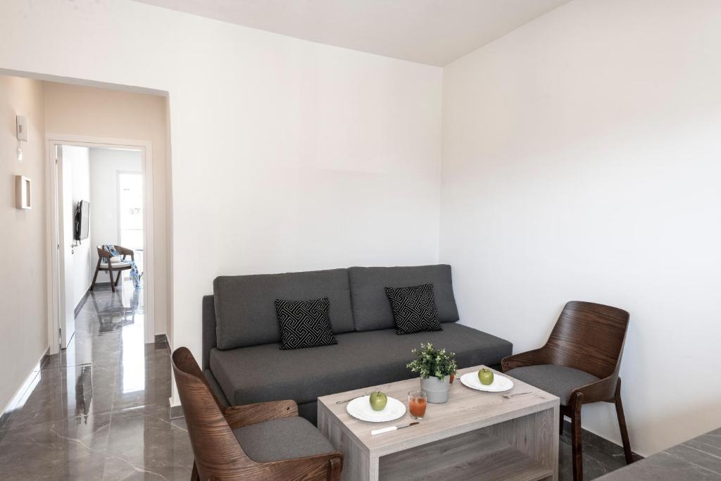 a living room with a couch and a table at Blazer Residence in Larnaka