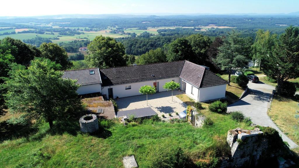 an aerial view of a house on a hill at La Maison du Fort de Fontain Villa Mac Mahon vue superbe Montagnes du Jura in Fontain