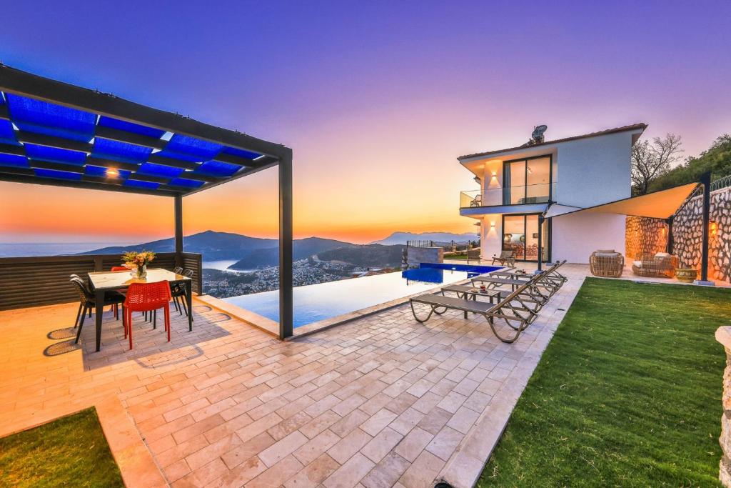 a home with a view of the ocean at Luxury Sea View Villa w Pool Near Beach in Kalkan in Kalkan