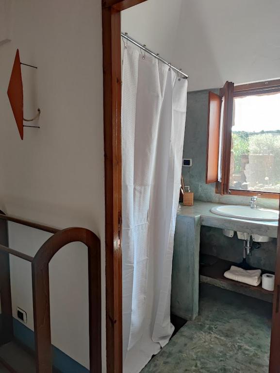 Postel nebo postele na pokoji v ubytování BIOdammuso