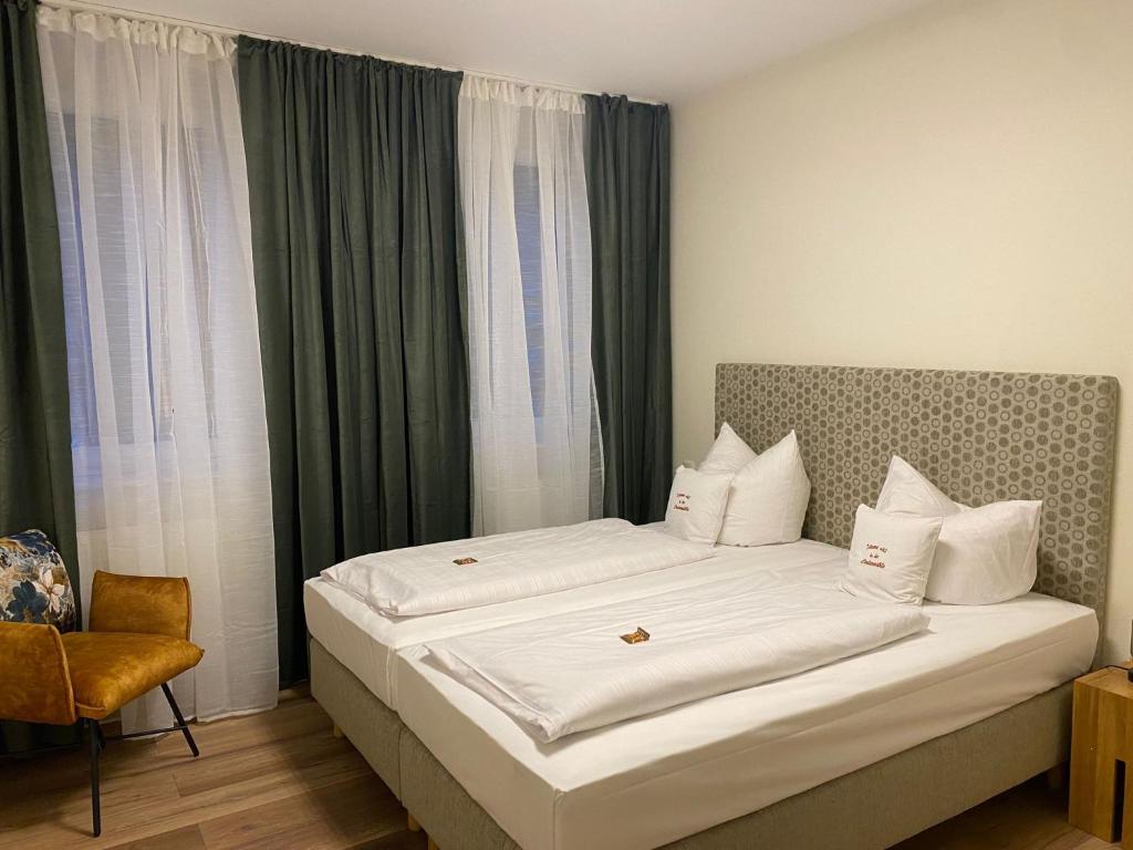Postel nebo postele na pokoji v ubytování Hotel Hartl's Lindenmühle