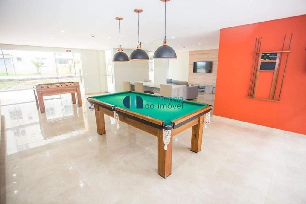 a living room with a pool table in it at Mar com Diversão in Barra Velha