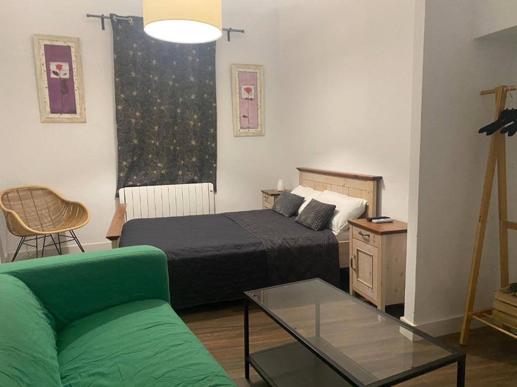 Postel nebo postele na pokoji v ubytování Apartamentos del Casco
