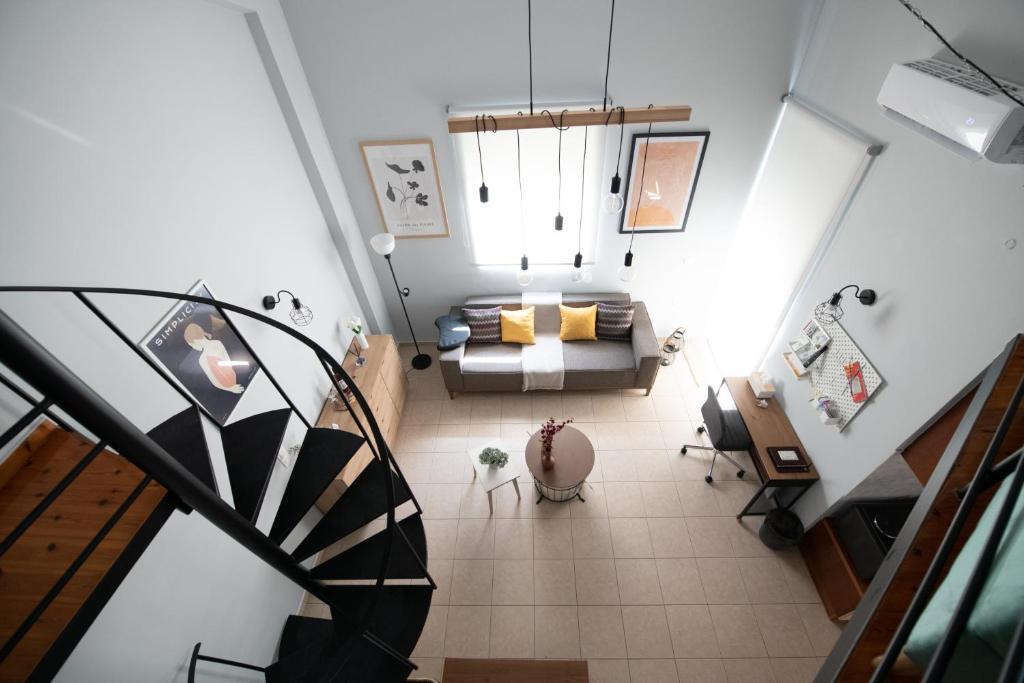 an overhead view of a living room with a couch at Minimal loft at Kastellokampos in Patra