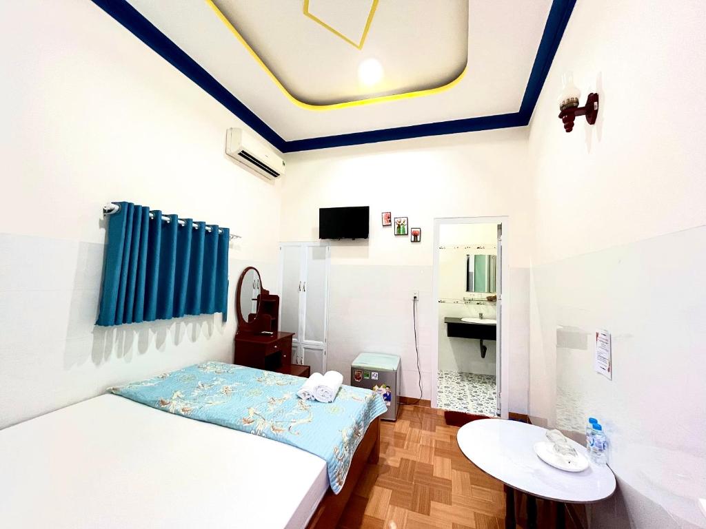 Giường trong phòng chung tại Minh Khoi Guest House