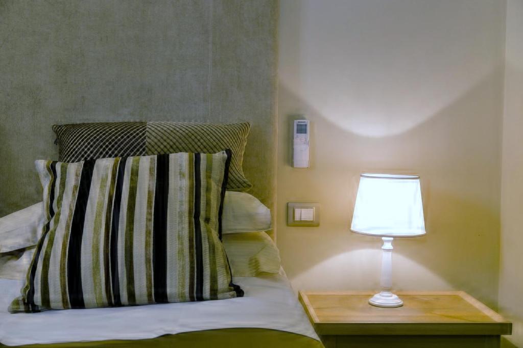 Łóżko lub łóżka w pokoju w obiekcie Hotel Valeri