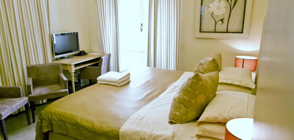 Łóżko lub łóżka w pokoju w obiekcie Hotel Valeri