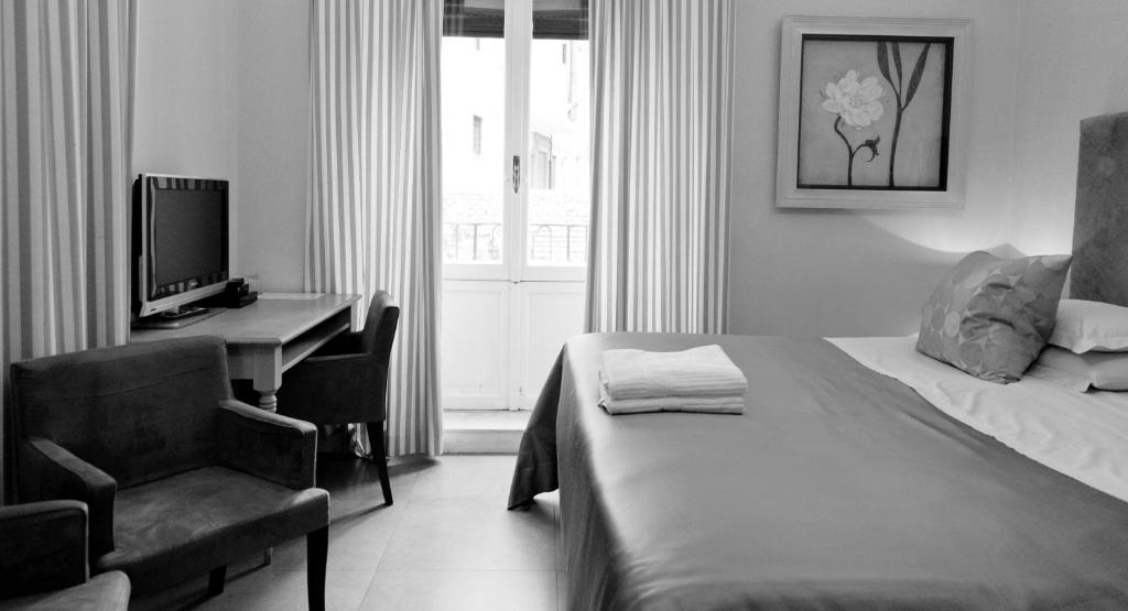 Łóżko lub łóżka w pokoju w obiekcie Hotel Valeri