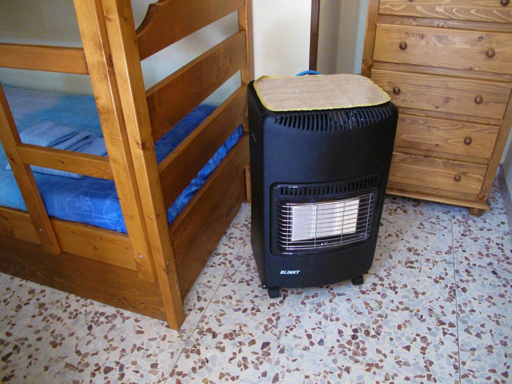 A bed or beds in a room at Diving Center Punta Stilo