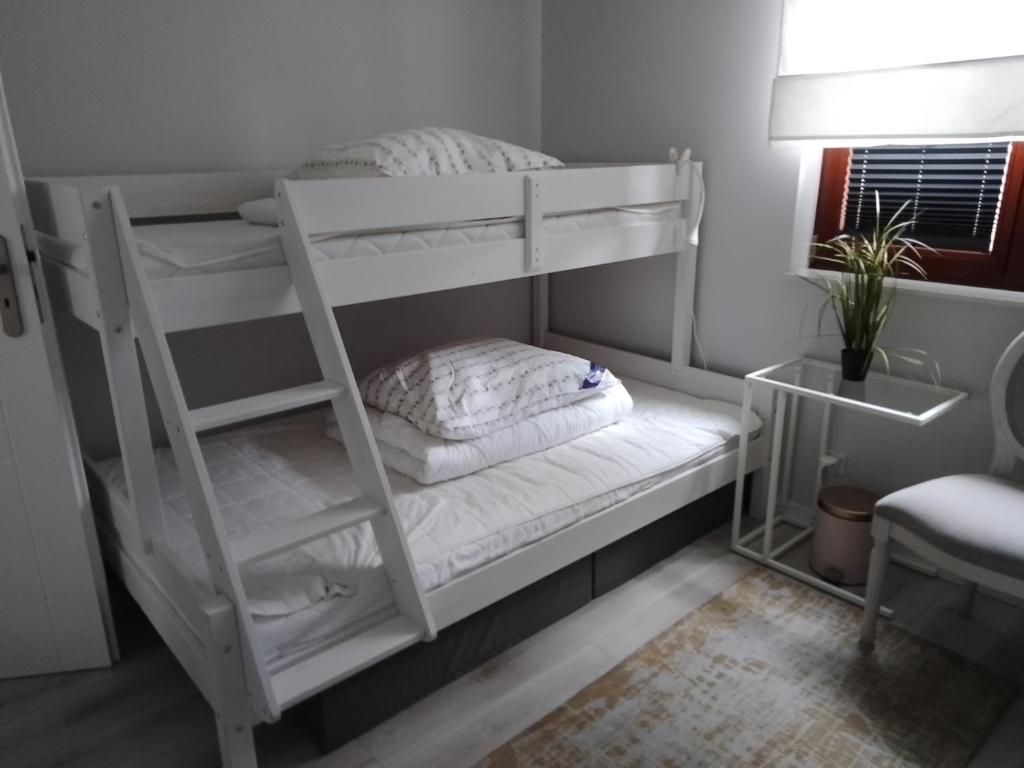 Postel nebo postele na pokoji v ubytování Maritima's Home