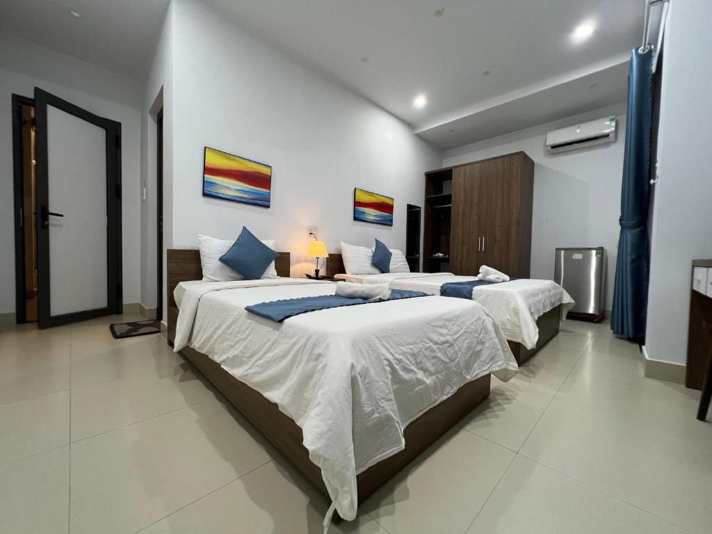 Giường trong phòng chung tại candyinn