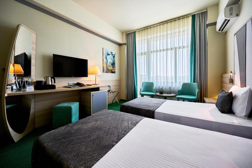 Postel nebo postele na pokoji v ubytování Hotel Malibu
