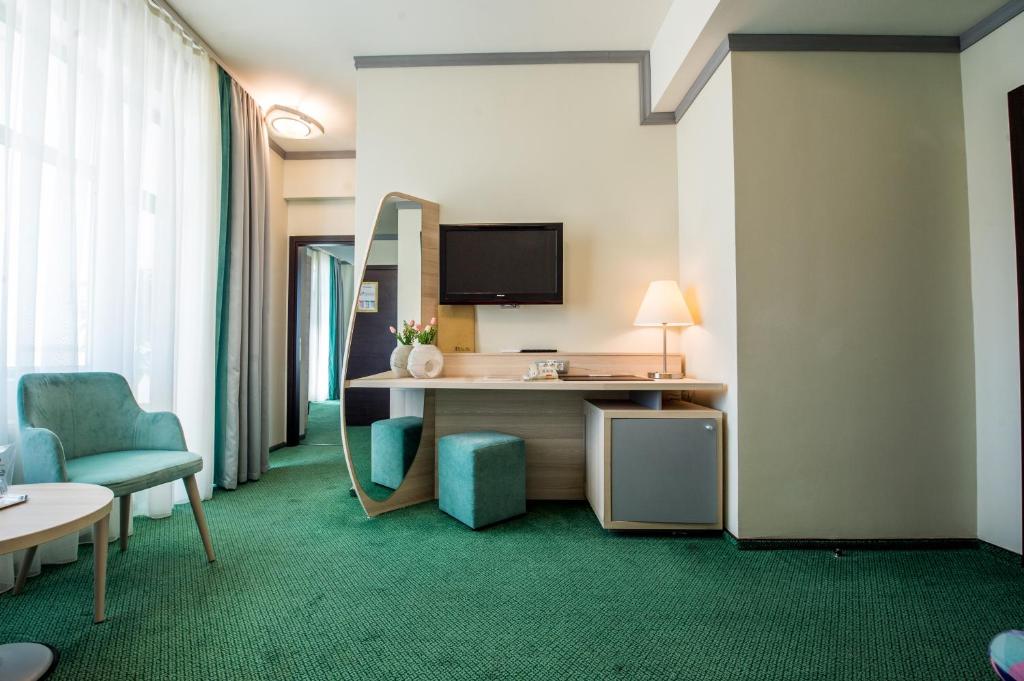 TV a/nebo společenská místnost v ubytování Hotel Malibu