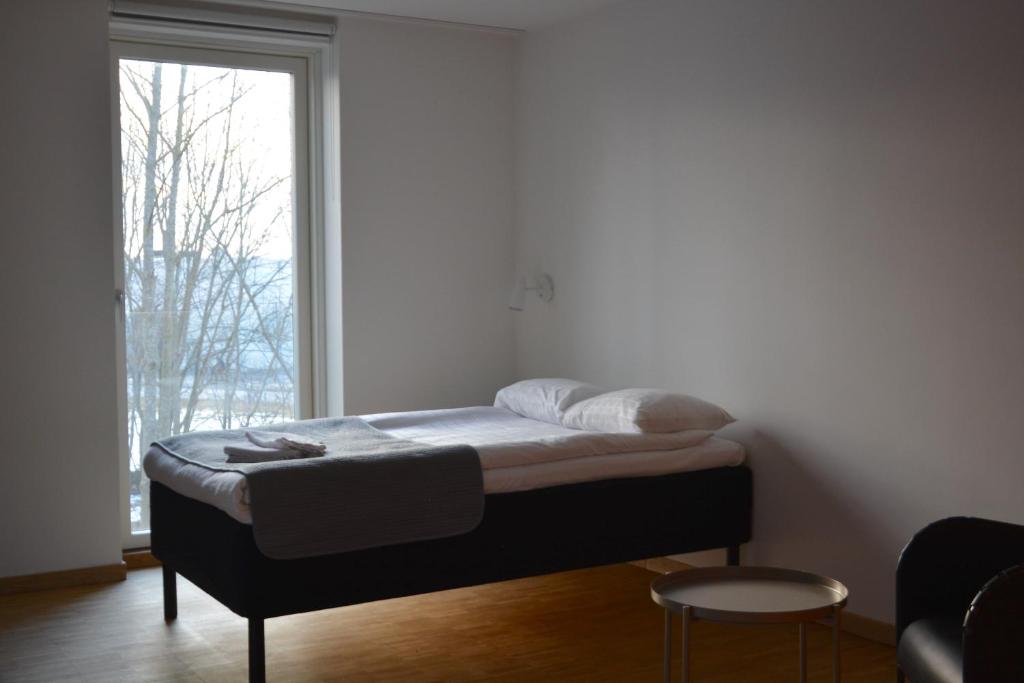 Postel nebo postele na pokoji v ubytování Forskarhotellet