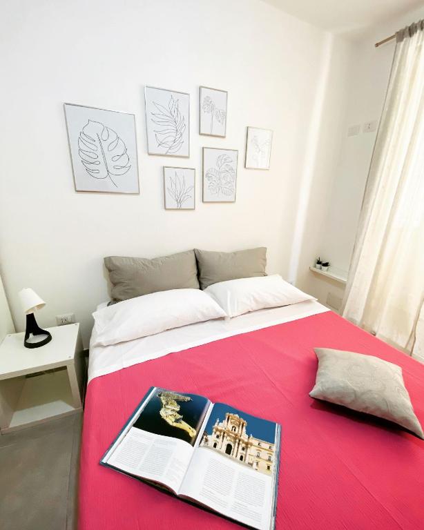 Postel nebo postele na pokoji v ubytování Casa 68 Ortigia
