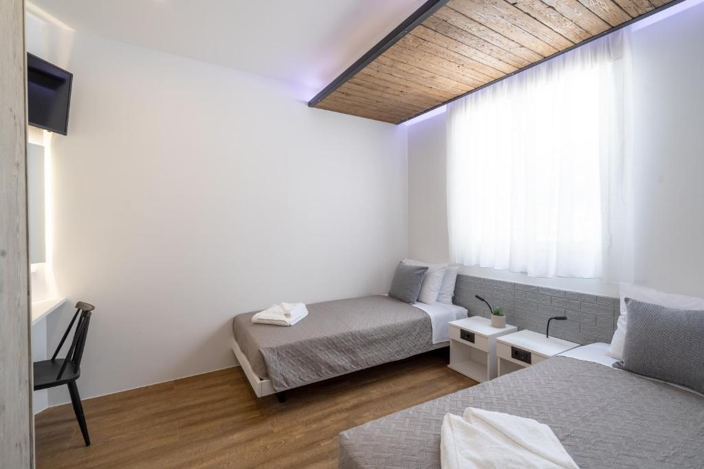Postel nebo postele na pokoji v ubytování 4C Rethymno