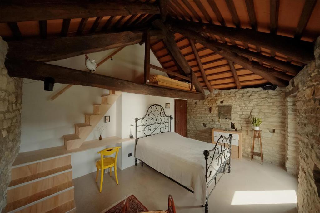 A bed or beds in a room at Country old stone house immerse in nature