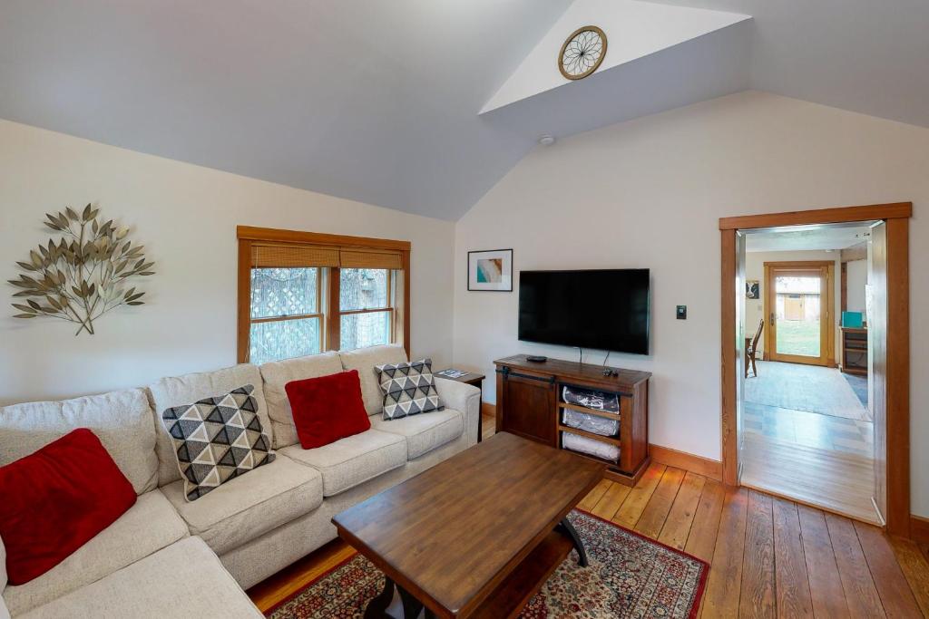 a living room with a couch and a table at Bozeman Bungalow at Beall in Bozeman
