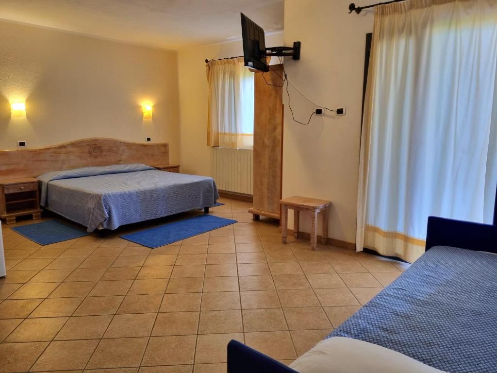 Łóżko lub łóżka w pokoju w obiekcie Hotel Delle Isole