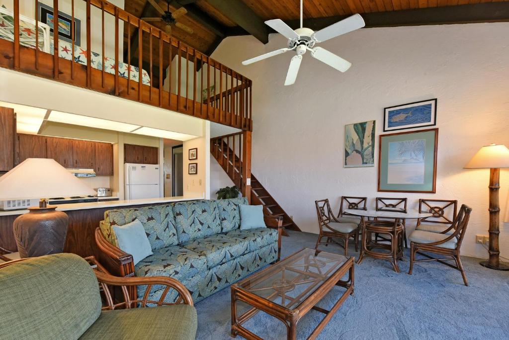 a living room with a couch and a table at Papakea Condo Unit D402 in Kahana