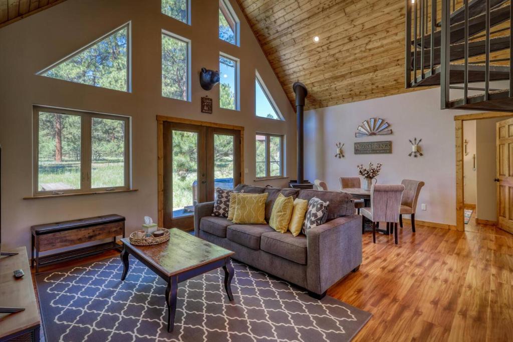a living room with a couch and a table at 374 Hills Circle in Nutria