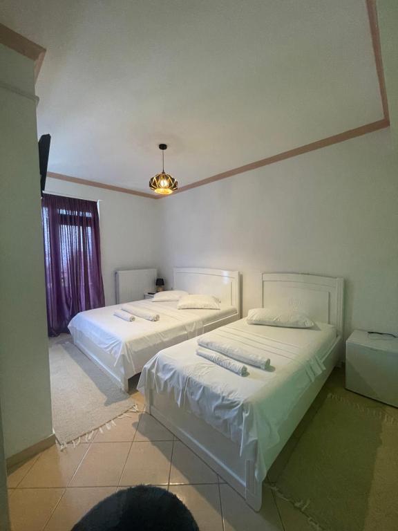 Postel nebo postele na pokoji v ubytování HOTEL VILA TOSKA
