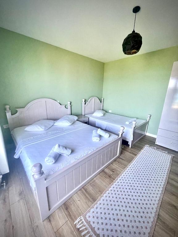 Postel nebo postele na pokoji v ubytování HOTEL VILA TOSKA