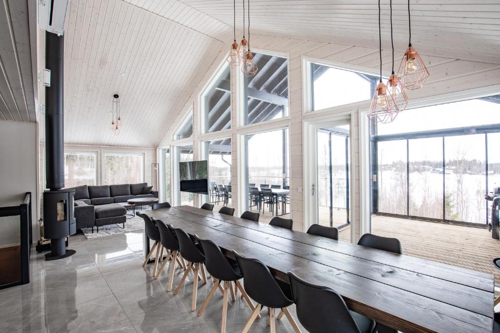 a large conference room with a long table and chairs at BestVillas Himos Finland in Jämsä