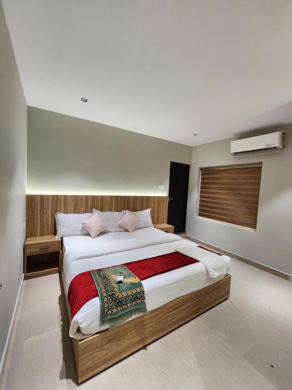 a bedroom with a large bed in a room at Muziris Manor Residency in Cochin