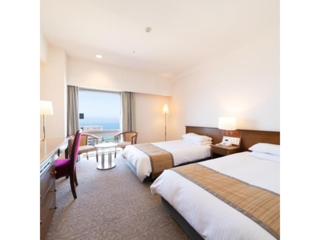 a hotel room with two beds and a desk at Hotel Terrace The Square Hitachi - Vacation STAY 17029v in Hitachi