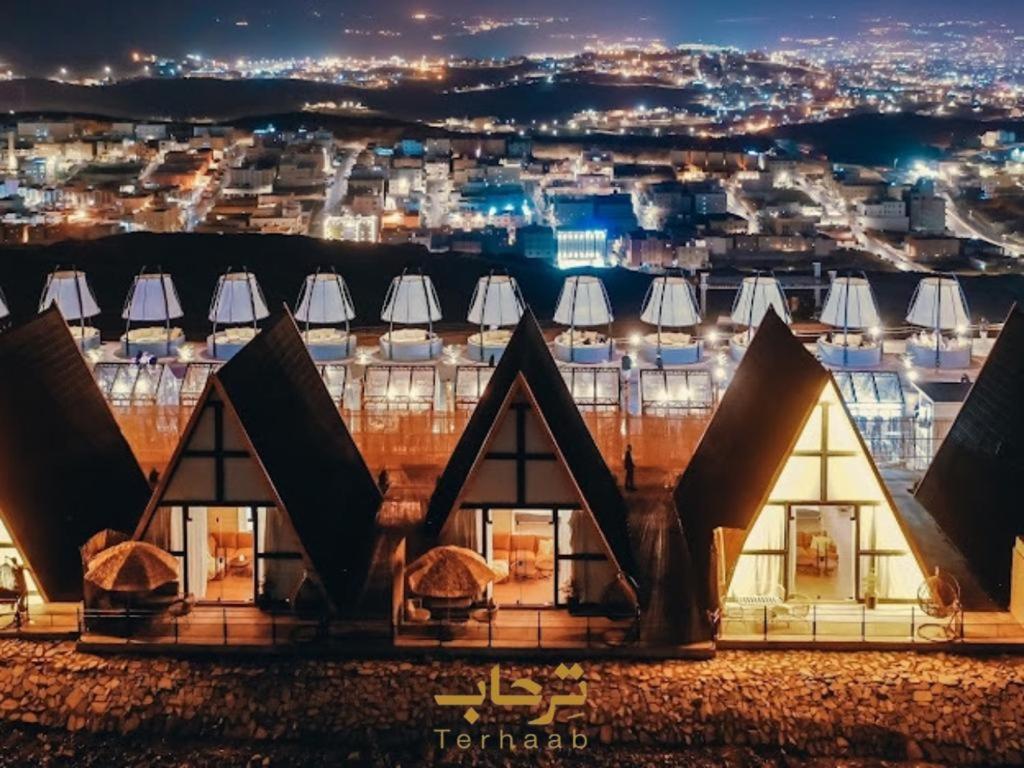 a view of the opera house at night at Terhabb Cottages in Abha