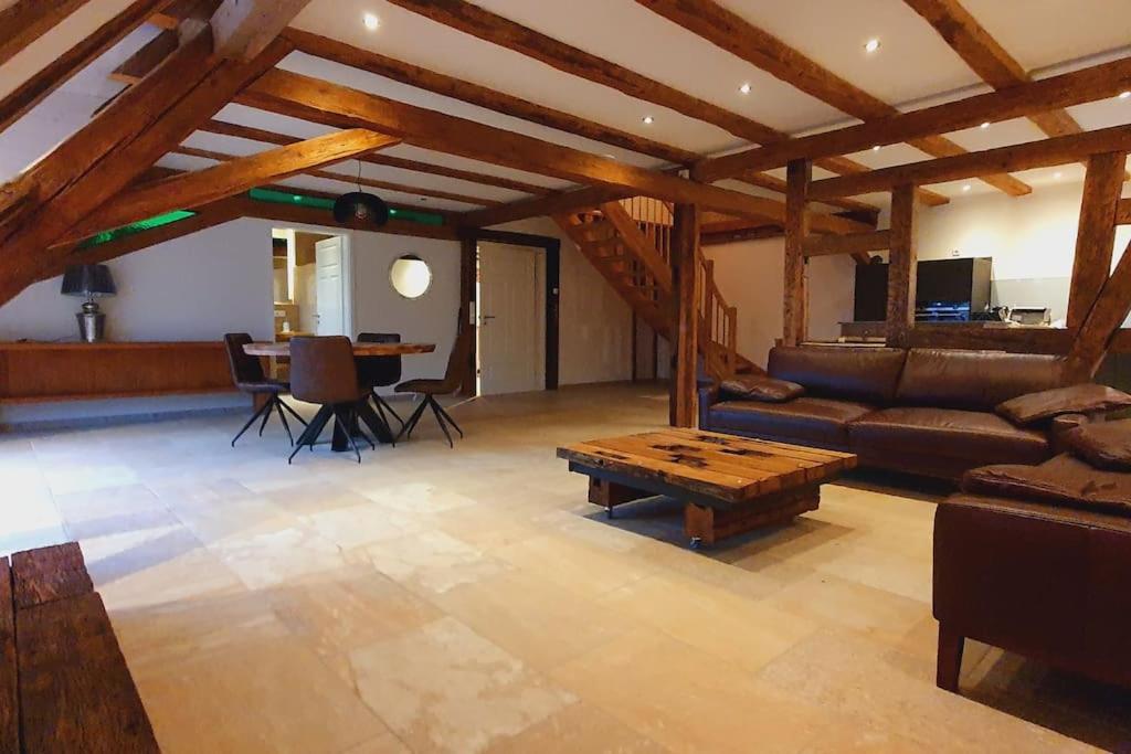 a living room with a couch and a table at Apartment Luna in Creglingen