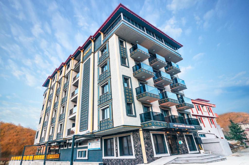 a large building with balconies on the side of it at OF UZUNGÖL APART OTEL in Of