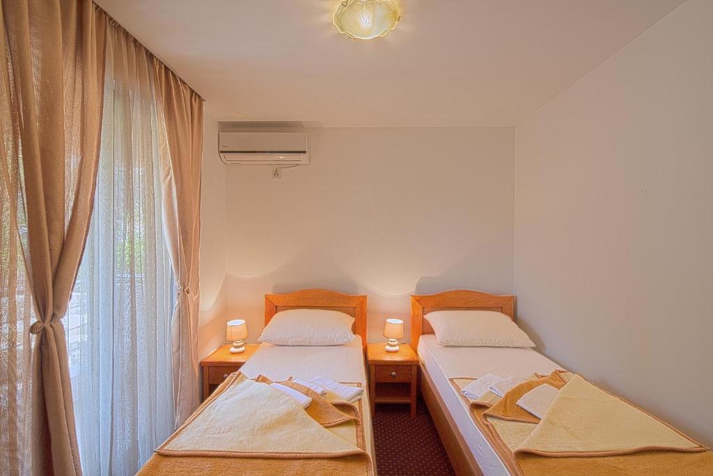 Postel nebo postele na pokoji v ubytování Villa Svinjista