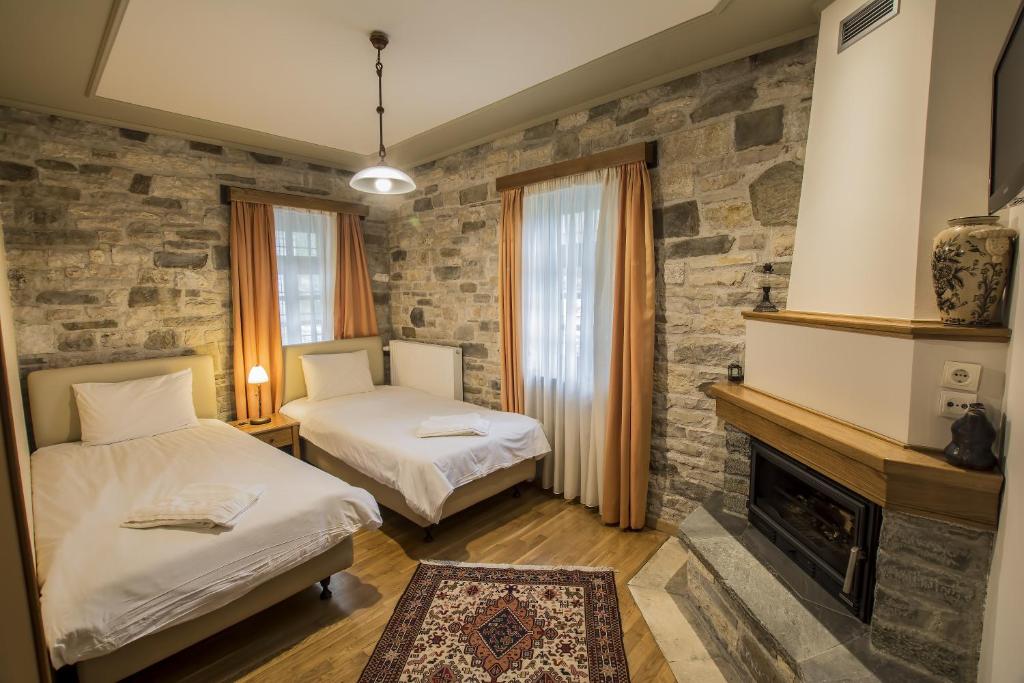 Postel nebo postele na pokoji v ubytování Gaia Guesthouse