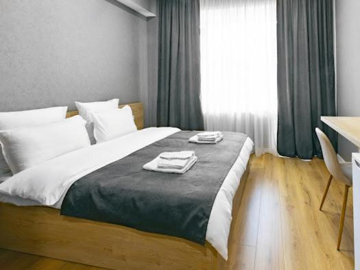 Postel nebo postele na pokoji v ubytování Hotel Caucasus Borjomi