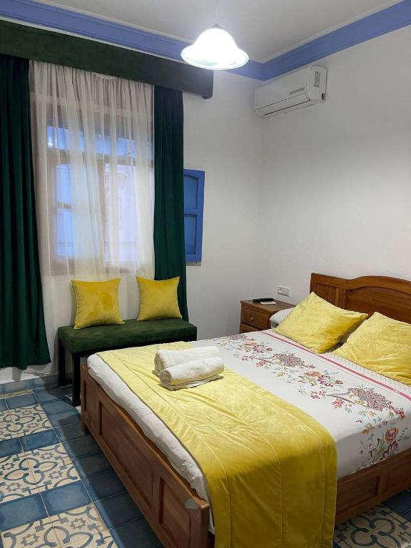 Voodi või voodid majutusasutuse Hôtel Al Kalaa toas