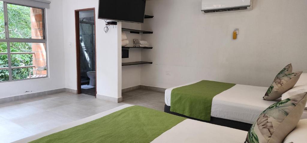 Postel nebo postele na pokoji v ubytování Hotel Parador del Gitano