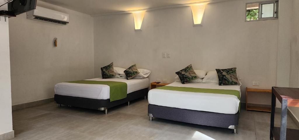 Postel nebo postele na pokoji v ubytování Hotel Parador del Gitano