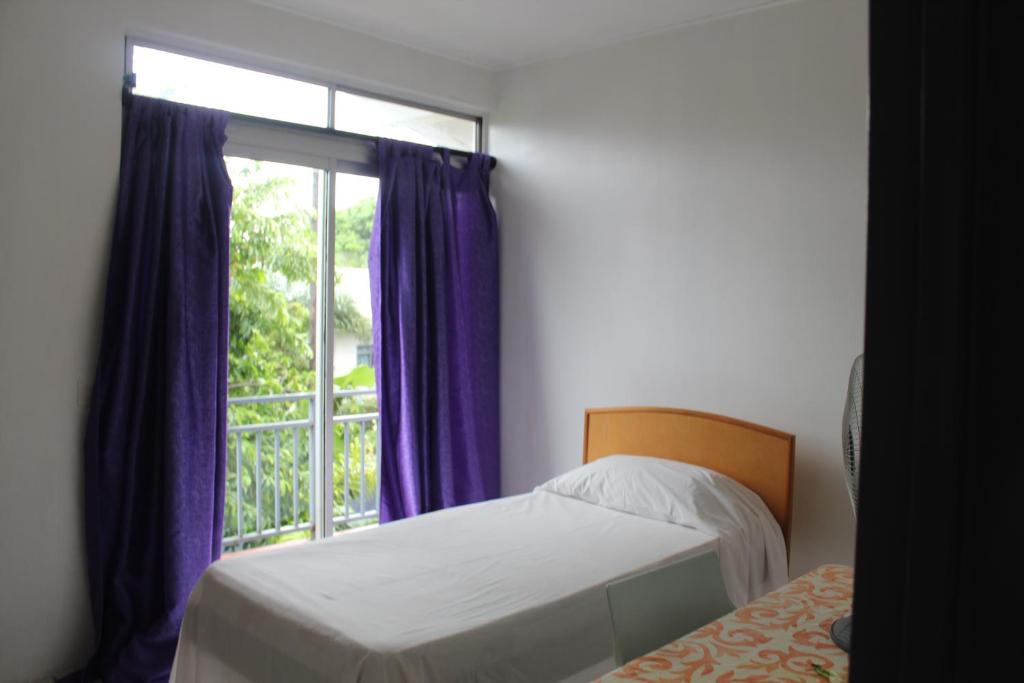 A bed or beds in a room at HIME LODGE