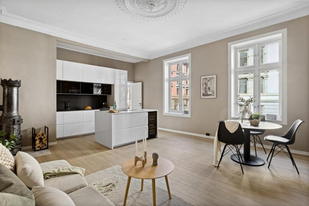 a living room with a couch and a table at Beautiful apartment in the heart of Oslo! in Oslo