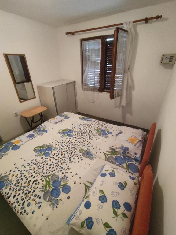 Postel nebo postele na pokoji v ubytování Apartmani Gina