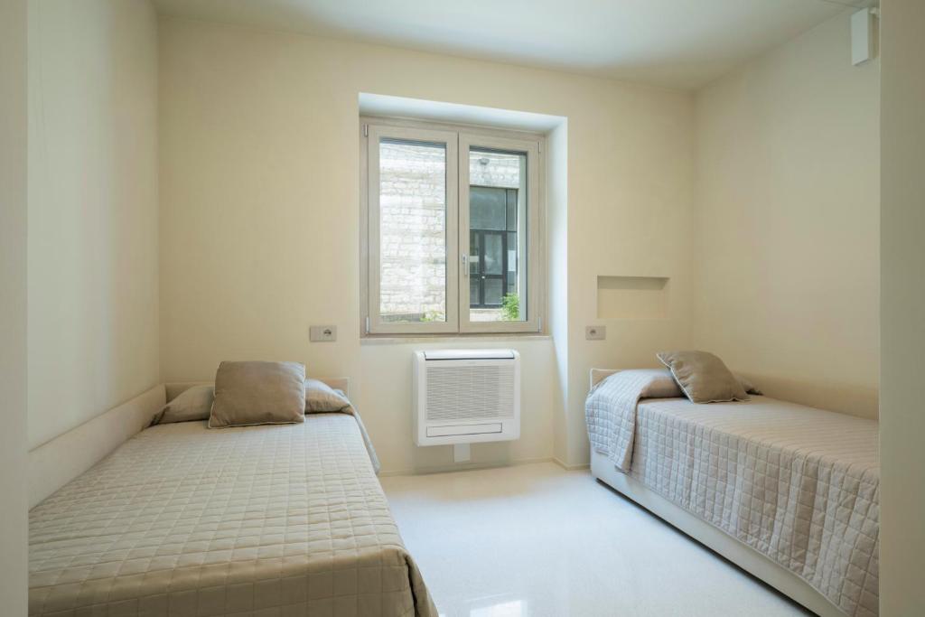 Postel nebo postele na pokoji v ubytování Marna Relais