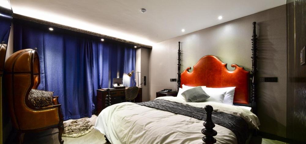 Postel nebo postele na pokoji v ubytování Hotel Ritz