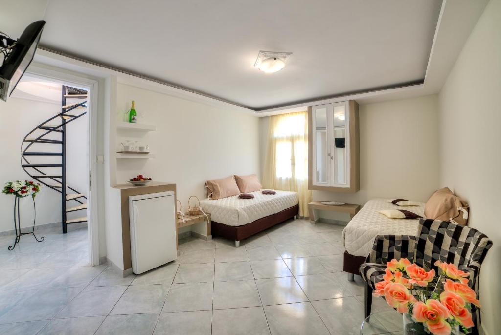 Postel nebo postele na pokoji v ubytování Pantheon Hotel