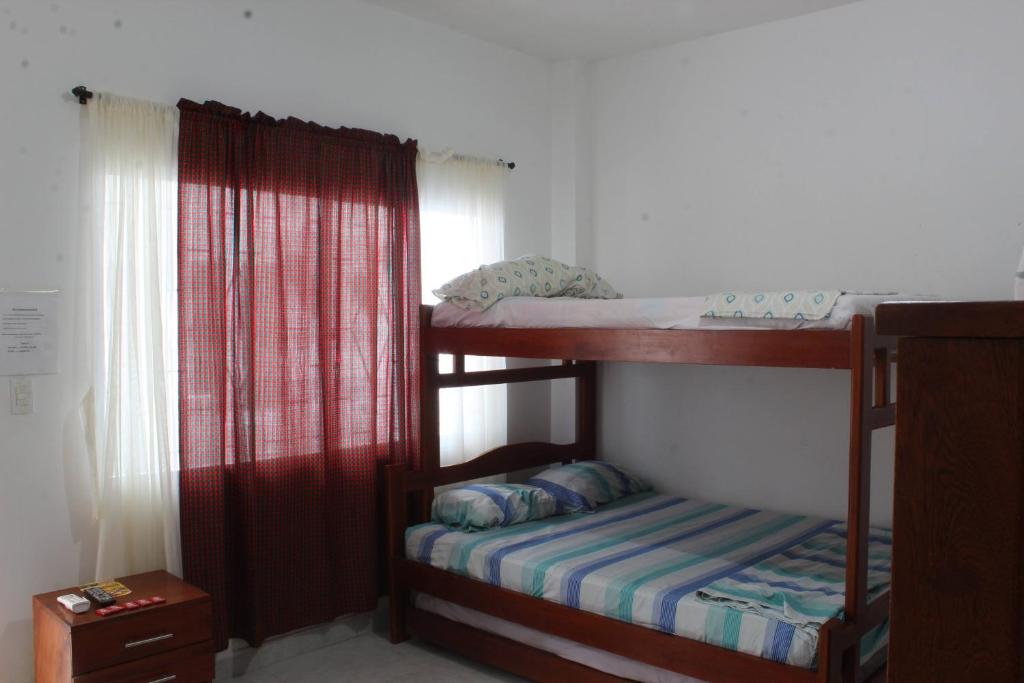 Postel nebo postele na pokoji v ubytování CASAS BLANCAS Coveñas