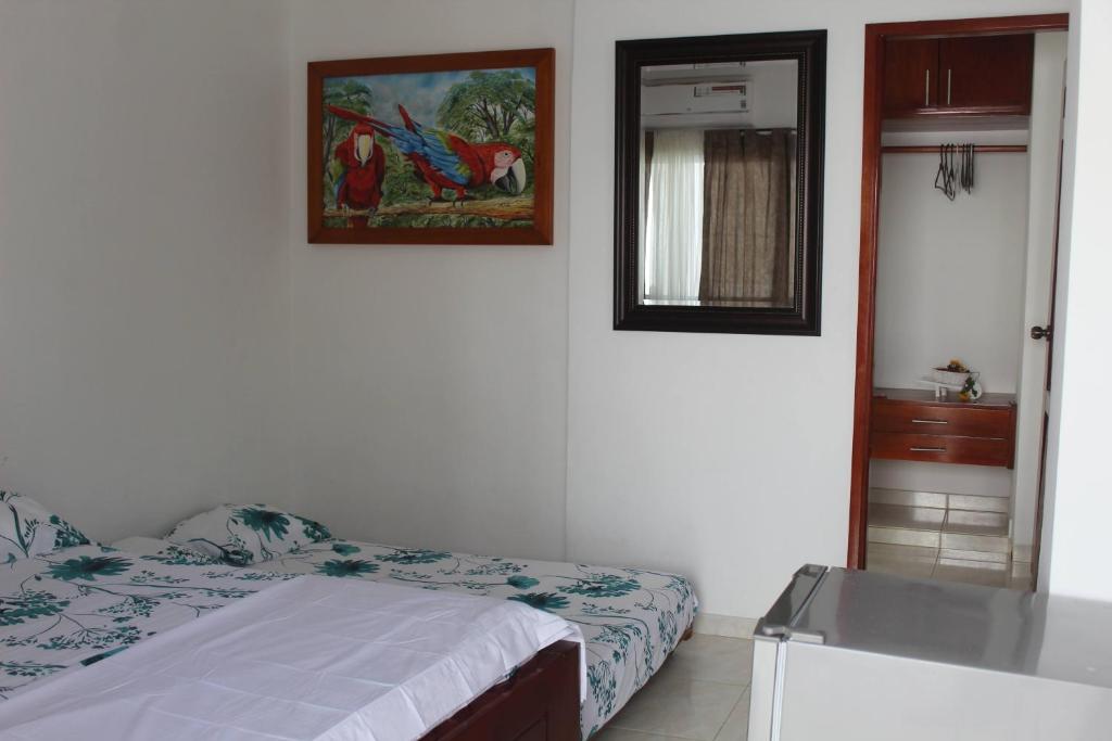 Postel nebo postele na pokoji v ubytování CASAS BLANCAS Coveñas