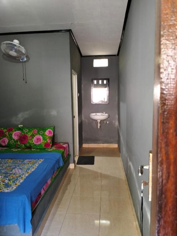 Postel nebo postele na pokoji v ubytování T&T Homestay